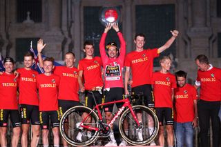 SANTIAGO DE COMPOSTELA SPAIN SEPTEMBER 05 A general view of Lennard Hofstede of Netherlands Steven Kruijswijk of Netherlands Robert Gesink of Netherlands Sepp Kuss of United States Primoz Roglic of Slovenia red leader jersey Nathan Van Hooydonck of Belgium Sam Oomen of Netherlands and Koen Bouwman of Netherlands and Team Jumbo Visma celebrate winning on the podium ceremony in the Plaza del Obradoiro with the Cathedral in the background after the 76th Tour of Spain 2021 Stage 21 a 338 km Individual Time Trial stage from Padrn to Santiago de Compostela lavuelta LaVuelta21 ITT on September 05 2021 in Santiago de Compostela Spain Photo by Gonzalo Arroyo MorenoGetty Images