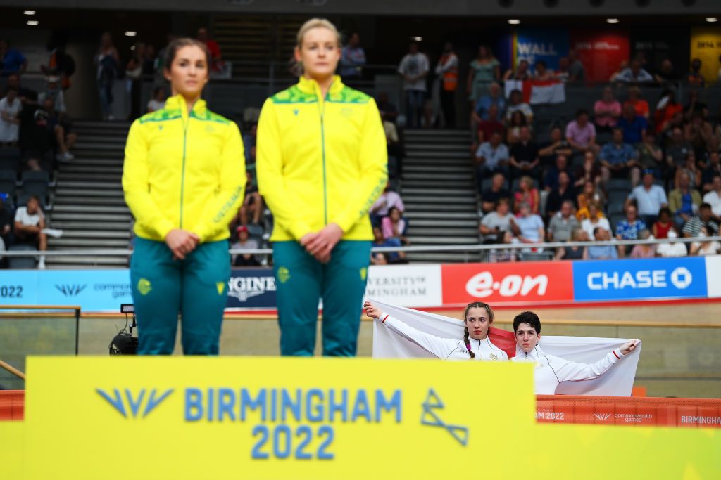 LONDON ENGLAND JULY 29 Bronze Medalists Sophie Unwin and Georgia Holt of Team England stand with their flag behind the podium after finishing third in the Womens Tandem B Finals on day one of the Birmingham 2022 Commonwealth Games at Lee Valley Velopark Velodrome on July 29 2022 on the London England Photo by Justin SetterfieldGetty Images