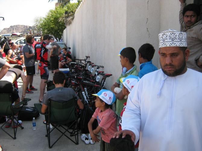 BMC riders find a bit of shade as they await the start of stage 4.