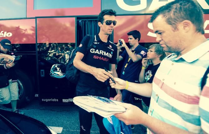 David Millar arrives at the bus having delayed on their journey into town as the traffic begins to back up.