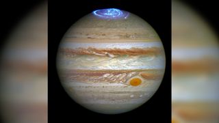 This NASA Hubble Space Telescope image shows auroras above the poles of Jupiter.