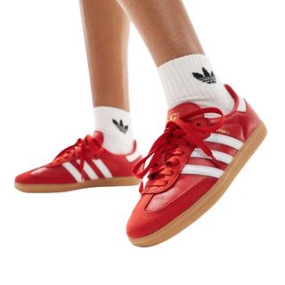 Flat lay image of red adidas sambas