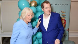 Camilla, Duchess of Cornwall, and Tom Parker Bowles attend the launch of the "Fortnum & Mason Christmas & Other Winter Feasts" cookbook