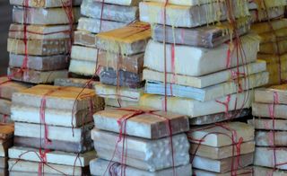 Stacks of books, tied with string sealed with wax