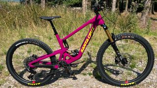 The Santa Cruz Bronson XO AXS RSV seen side on by a trail