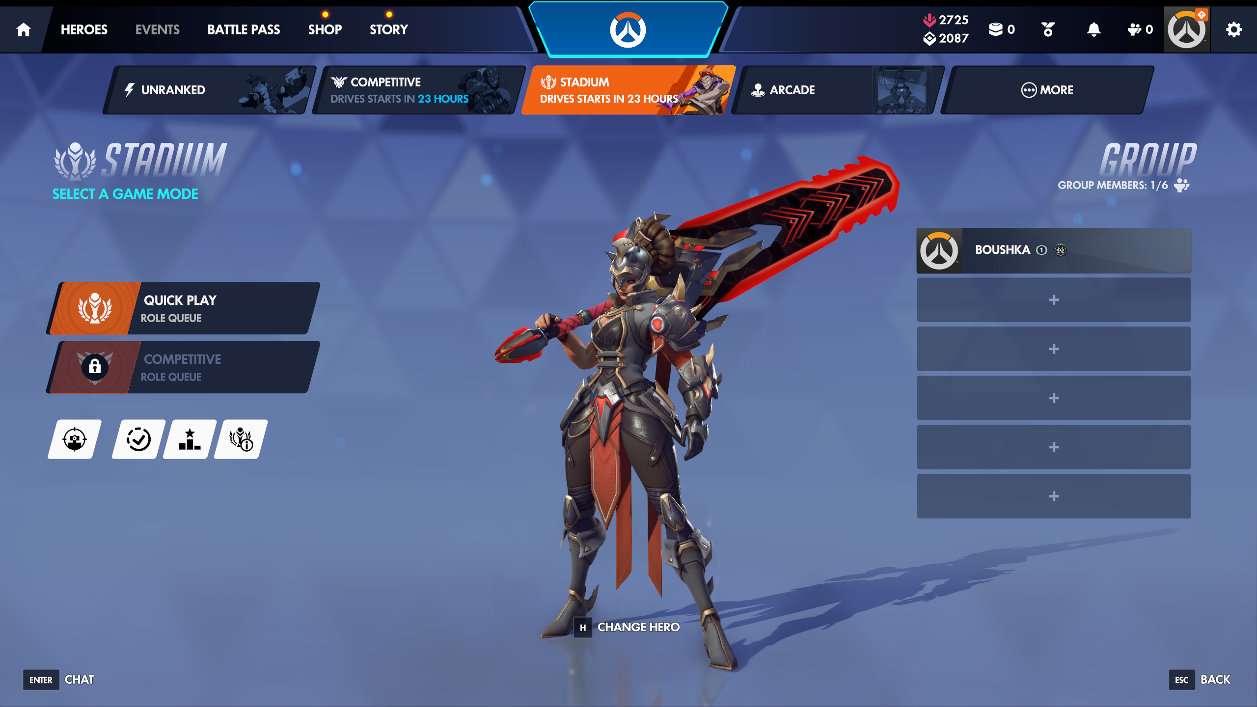 A screenshot of Overwatch's overhauled UI in its 2026 season 1. A hero with a massive red and black sword is standing in the middle and surrounded by a dark blue UI with the Overwatch logo at the top.