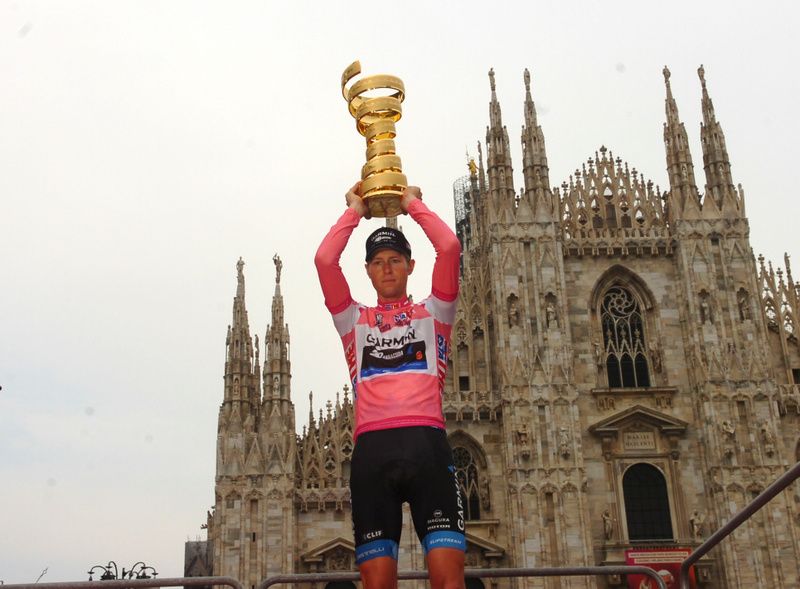 Ryder Hesjedal holds aloft the Giro trophy after his final day time trial saw him jump into the overall lead