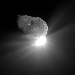A Deep Impact image of the flash caused by the mission's impactor spacecraft slamming into Comet Tempel 1, taken 67 seconds after the collision.