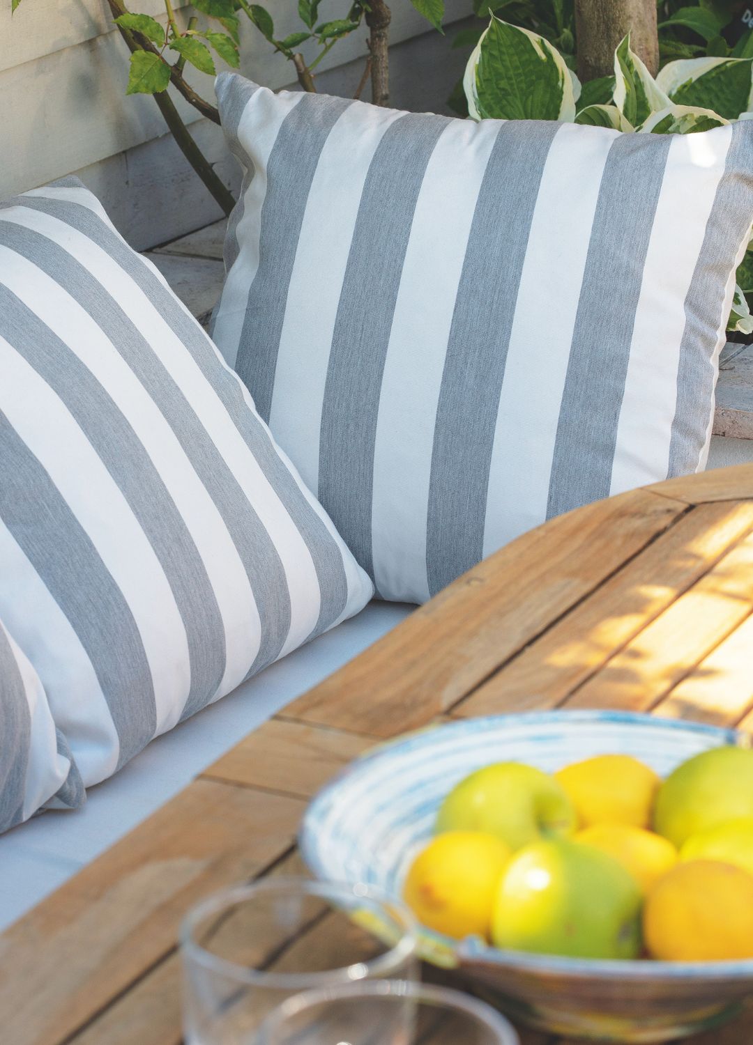 picture of two grey striped cushions on a outdoor seating