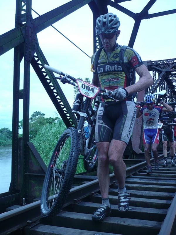 Race leader Ben Sonntag crosses the railroad bridge