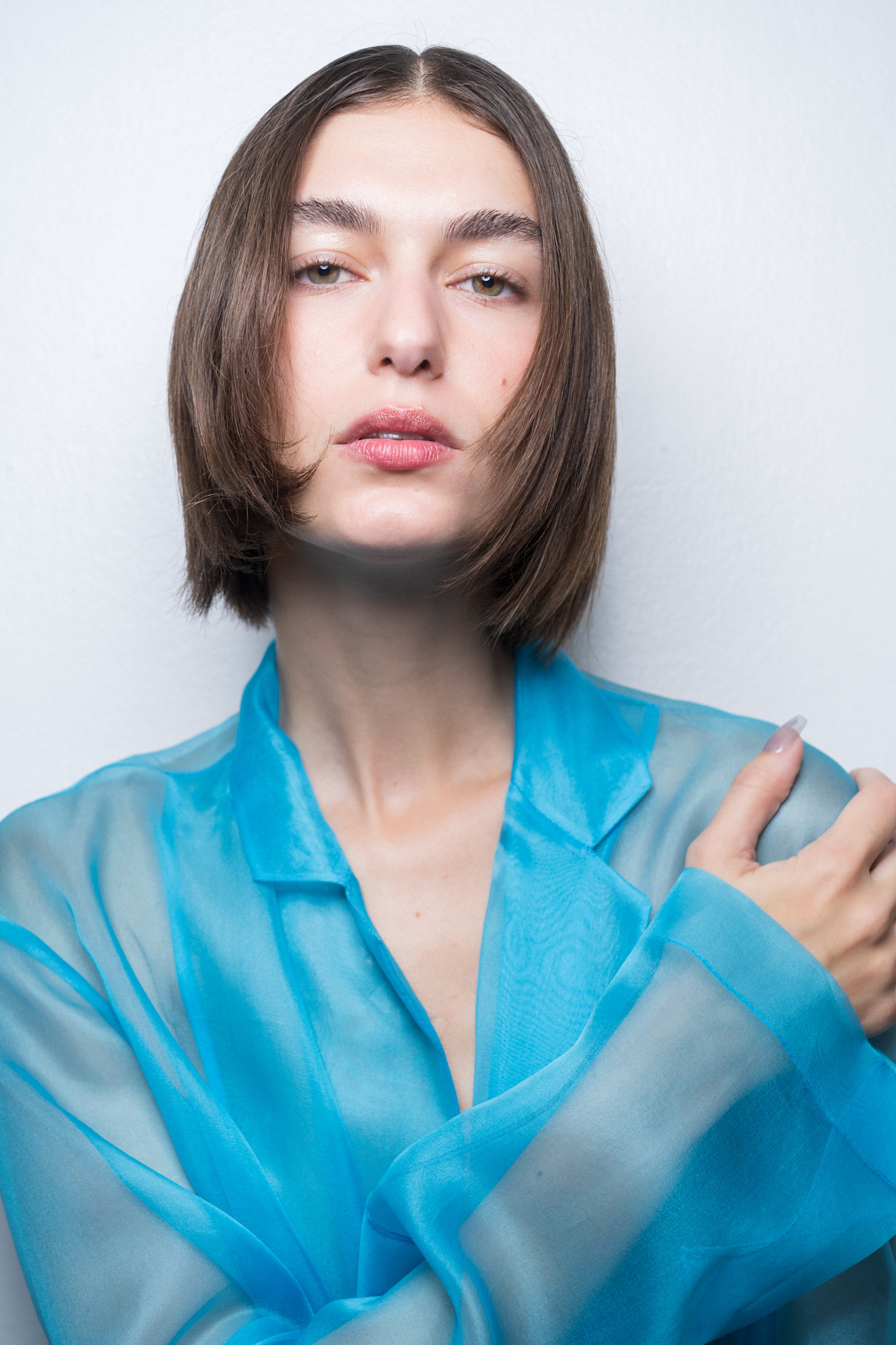 Situationist bks S27 070 show model with face framing french and blue taffeta shirt
