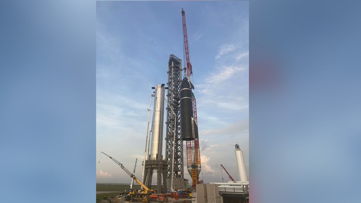 SpaceX's first orbital Starship SN20 is stacked atop its massive Super Heavy Booster 4 for the first time on Aug. 4, 2021 at the company's Starbase facility near Boca Chica Village in South Texas. They stood 395 feet tall, taller than NASA's Saturn V moon rocket.