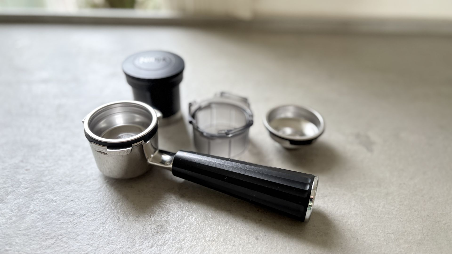 Tools for making coffee in the Ninja Luxe Caf&amp;eacute; Mini Plus Espresso Machine