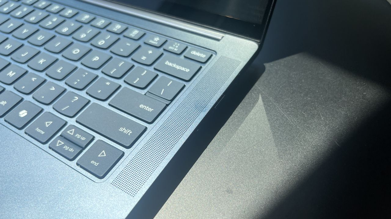 blue laptop on table