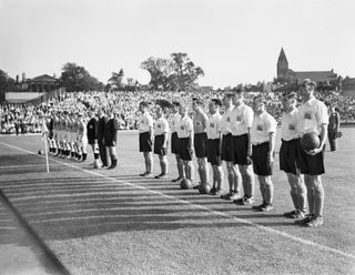 The Netherlands (left) and Great Britain line up ahead of a match at Highbury in the 1948 Olympics in London.