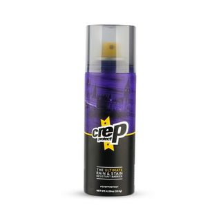 A spray bottle Crep Protect Shoe Protector Spray with black, purple and yellow label and clear lid