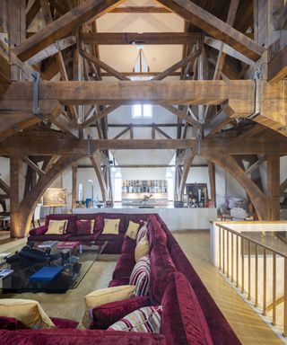 Living room with exposed beams in St Pancras penthouse apartment