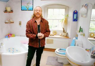 men with bathroom bathtub wash basin and white walls