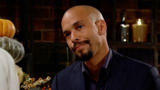 Bryton James as Devon sitting in a suit in The Young and the Restless