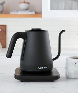 A Cuisinart gooseneck electric kettle on a marble worktop