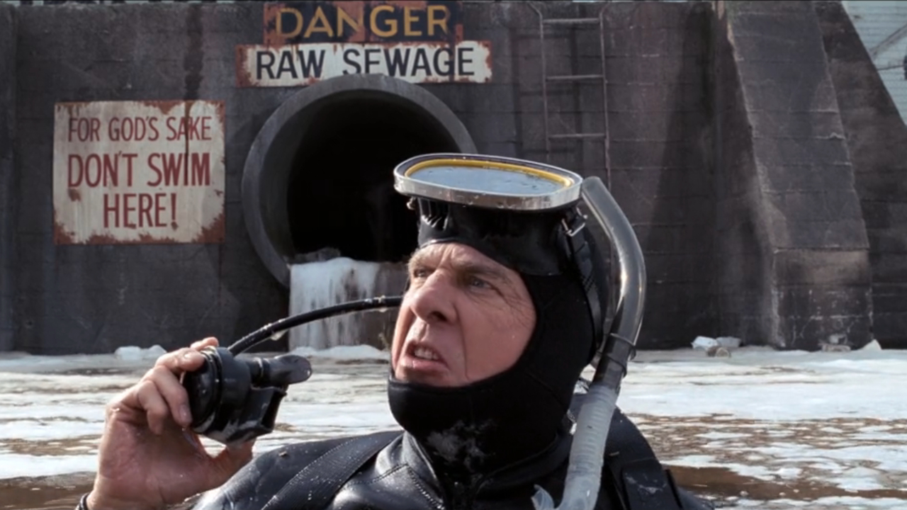 Leslie Nielsen raises his nose in disgust swimming in raw sewage in The Naked Gun 2 1/2 The Smell Of Fear.