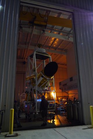 This photo shows the Comet ISON-hunting BRRISON balloon gondola pointing out the door of the hangar for a night time pointing test, to acquire images of stars and planets with both instruments. The instrument will ride a giant NASA balloon to track Comet ISON, the potential "comet of the century."