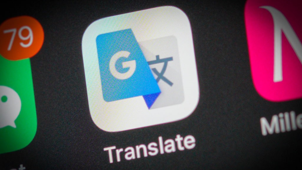 A close-up of a smartphone screen shows the Google translate app.
