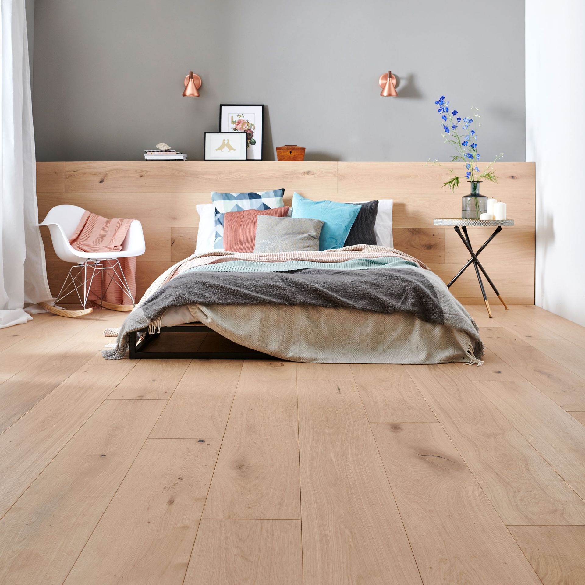 wide plank wooden flooring in bedroom