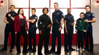From L to R: Oliver Stark, Jennifer Love Hewitt, Kenneth Choi, Angela Bassett, Peter Krause, Aisha Hinds, Gavin McHugh, and Ryan Guzman pose for 9-1-1 Season 7.