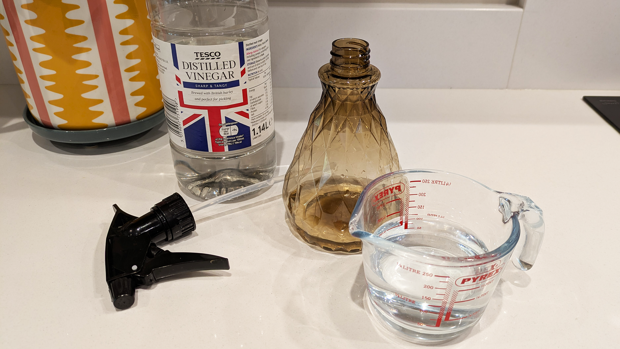 Making up a vinegar and water solution for cleaning windows