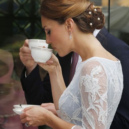 Kate Middleton drinking a cup of tea.