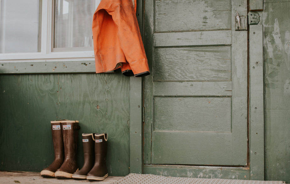 Two pairs of Xtratuf boots.