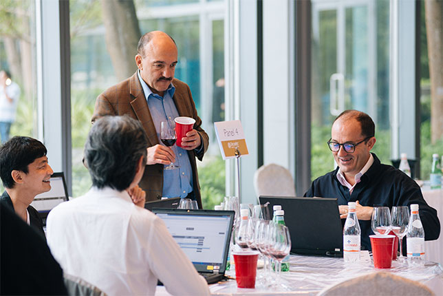 Gerard Basset MS MW judge and vice chair discussing with panel