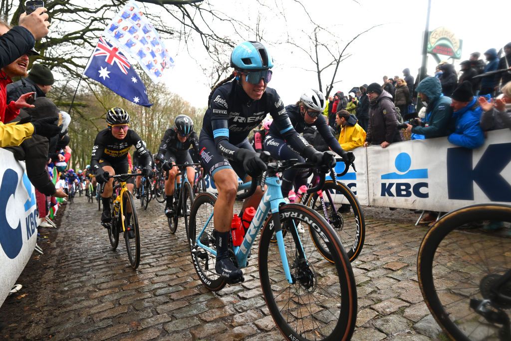 WEVELGEM BELGIUM MARCH 26 LR Eva Van Agt of The Netherlands and Team JumboVisma Shirin Van Anrooij of The Netherlands and Team Trek Segafredo and Lonneke Uneken of The Netherlands and Team SD Worx compete passing through a Kemmelberg cobblestones sector during the 12th GentWevelgem In Flanders Fields 2023 Womens Elite a 1625km one day race from Ypres to Wevelgem UCIWWT on March 26 2023 in Wevelgem Belgium Photo by Luc ClaessenGetty Images
