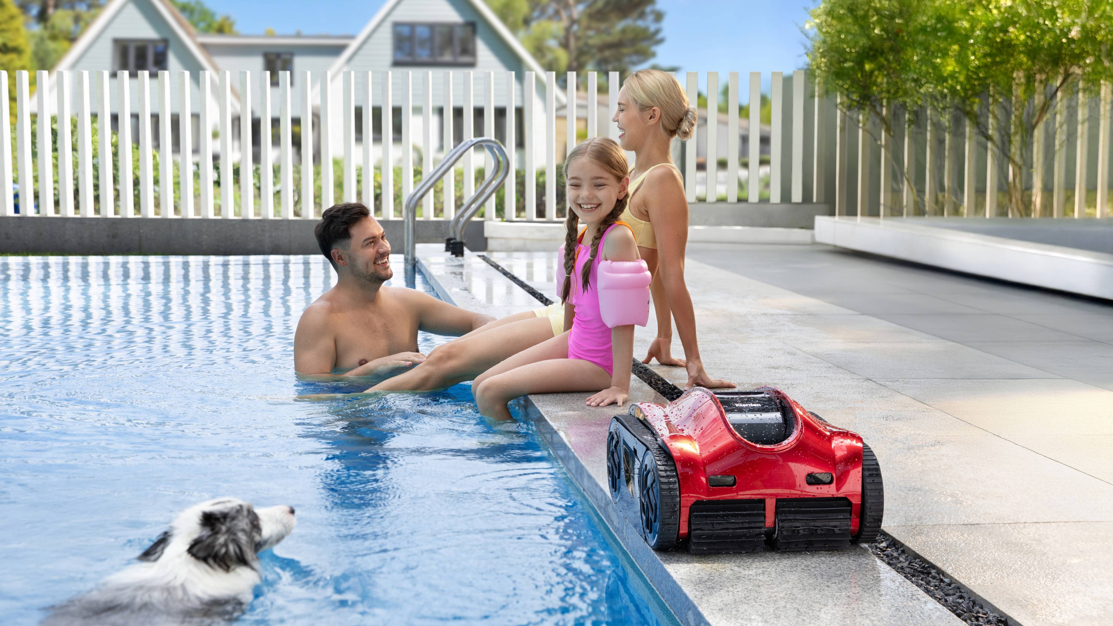 A family at poolside with the iGarden Pool Cleaner K