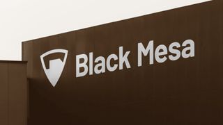 Black Mesa&#039;s company logo in white as it appears against a black building&#039;s exterior