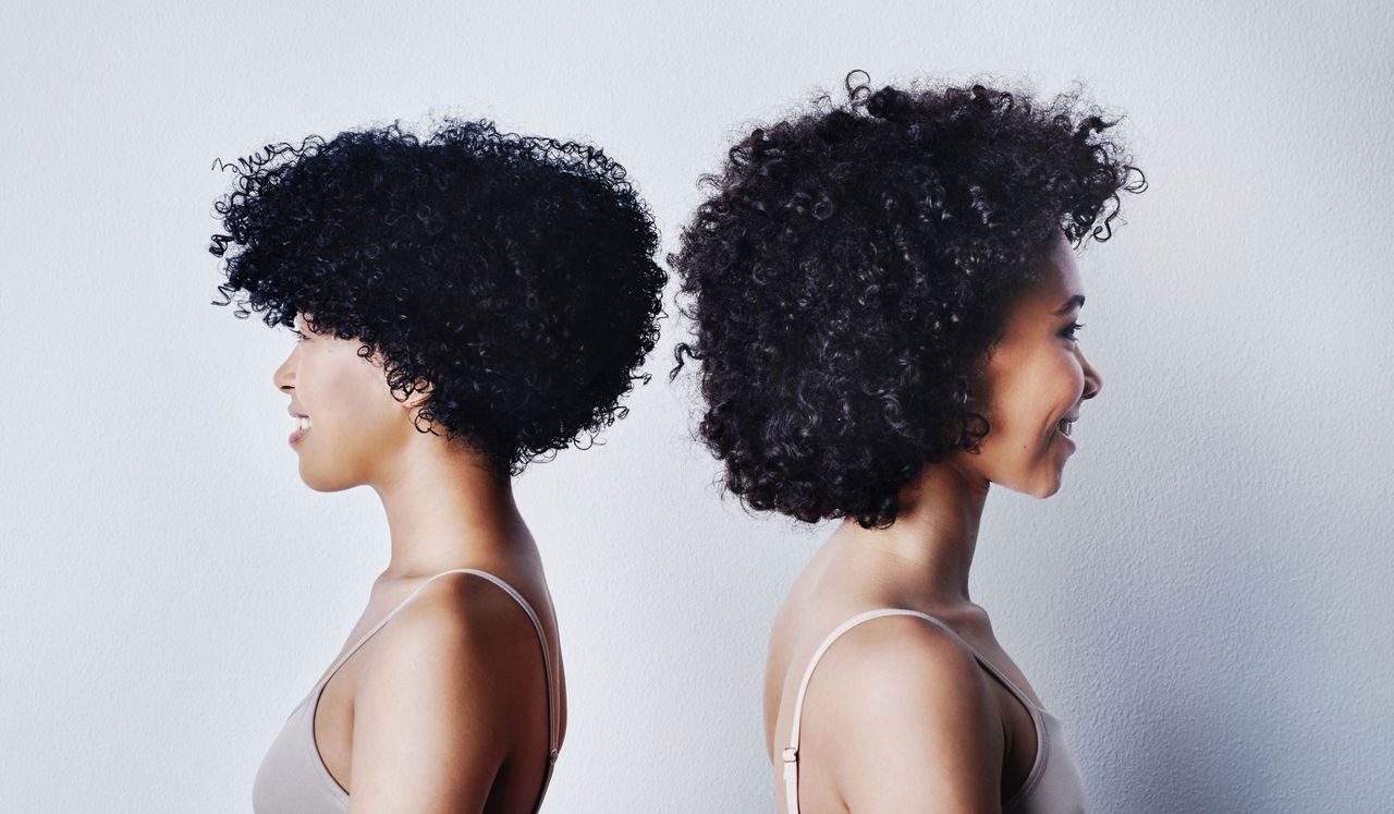 two women with curly hair