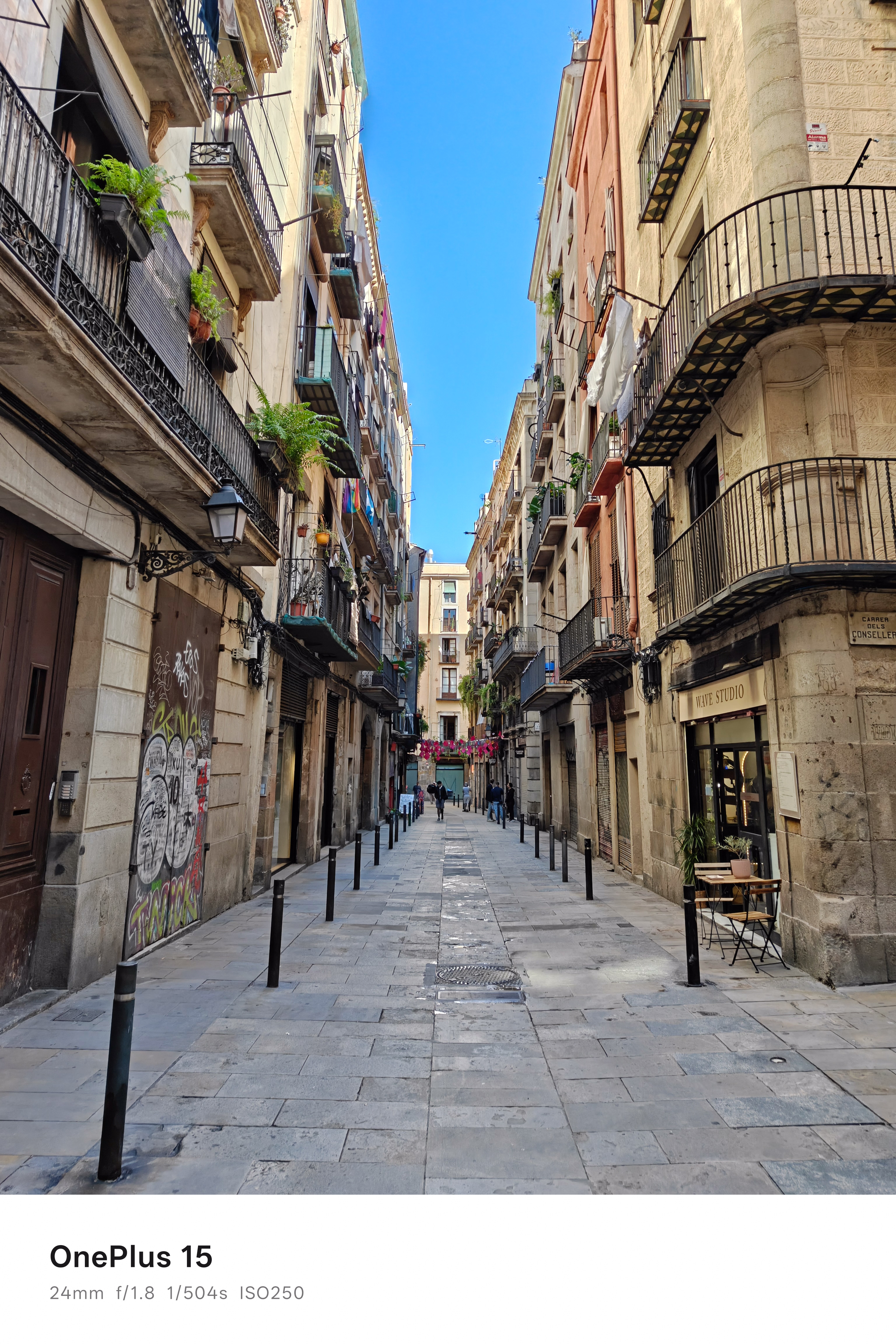A narrow street lined with buildings in Barcelona, Spain