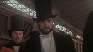 Sean Connery wearing a top hat at a station in The Great Train Robbery