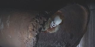 Pennywise the clown in a sewer pipe in IT