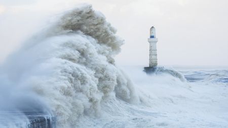 Storm waves hitting Aberdeen Harbour in Scotland during Storm Babet in 2023.