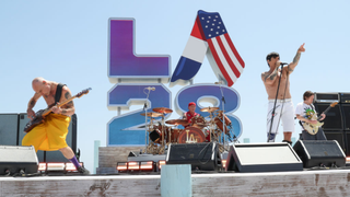 Flea, Chad Smith, Anthony Kiedis, and John Frusciante of Red Hot Chili Peppers perform at the LA28 Olympic Games Handover Celebration. 