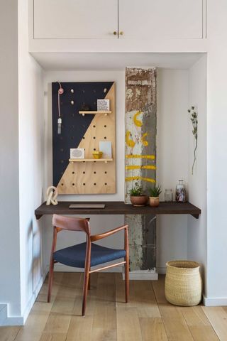 a desk in a small alcove in an apartment