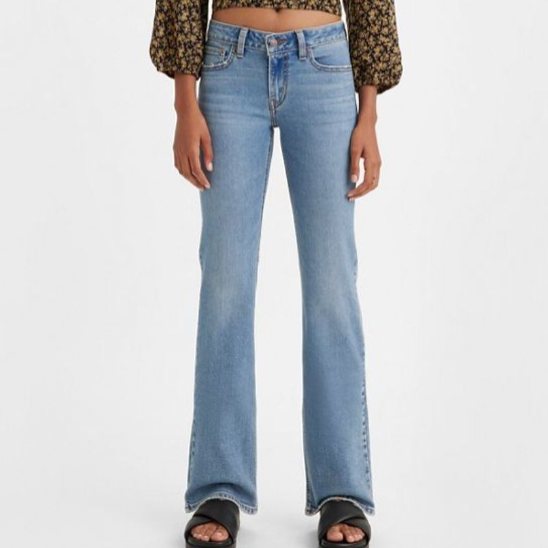 model wearing blue levis supercut low bootcut jeans