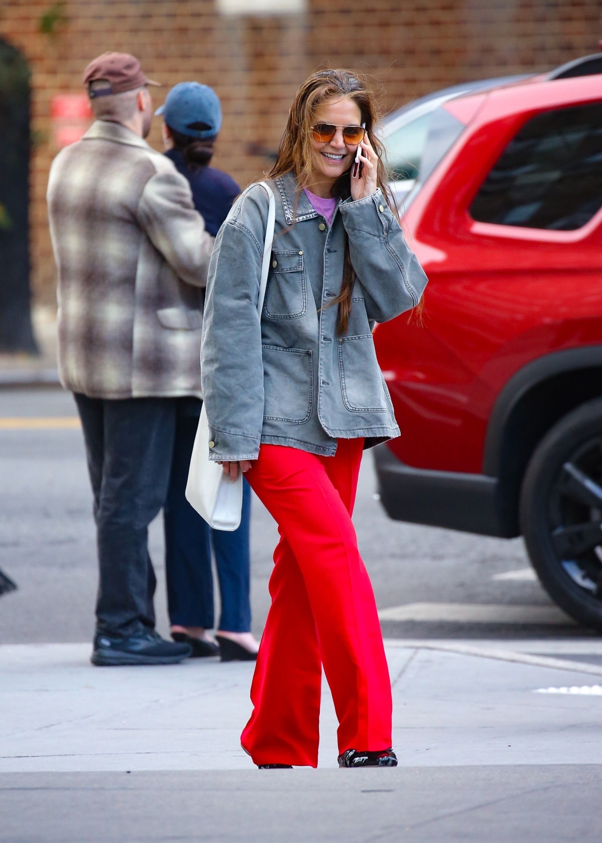 Katie Holmes wears red trousers in New York City