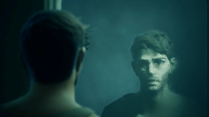 A man stares at himself in the mirror