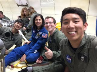 From left: Student Victor Hong, NASA astronaut Nicole Stott, Andrew Beeler and Henry Lu pose for a selfie aboard a their zero-gravity flight on April 10, 2014. The University of California, San Diego students were testing how biofuels burn in weightless conditions.