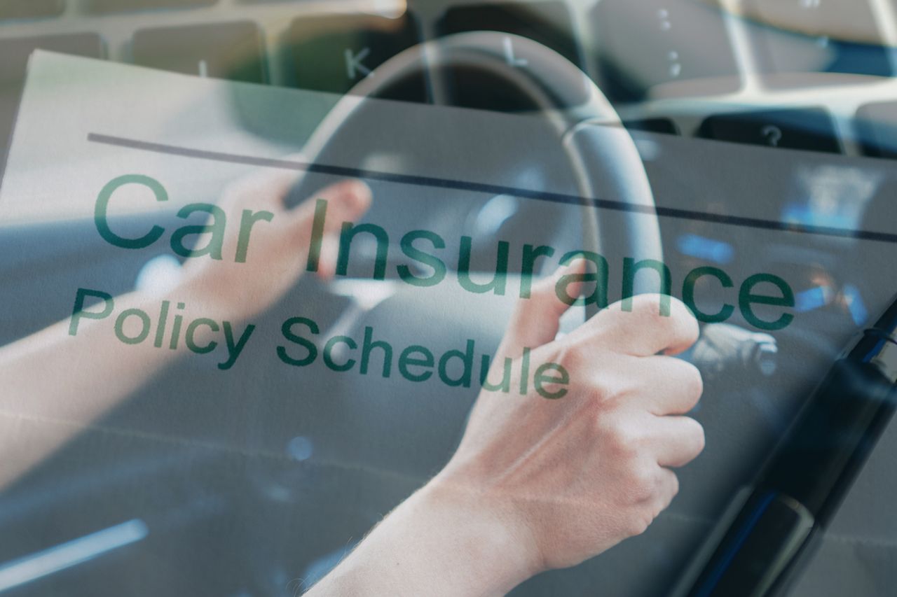 No claims bonus document in front of person driving car (images: Getty Images)