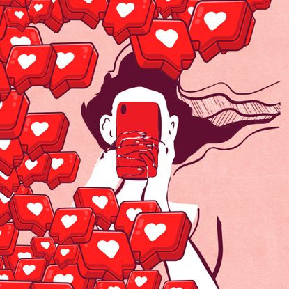 Heart emojis surround a woman on her phone