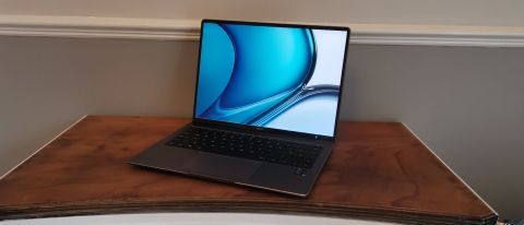 The Huawei MateBook 14s resting on a wooden side table